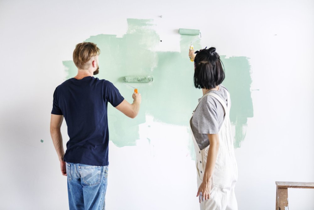 People painting a wall