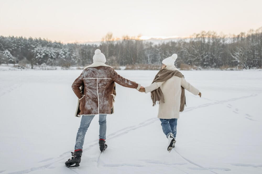 A couple ice-skating after cross-country moving