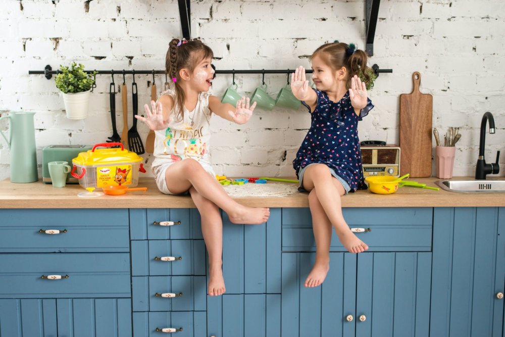 Two girls playing before cross-country movers come to relocate the household