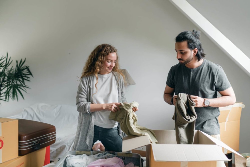 a couple packing an essential bag for long-distance moving