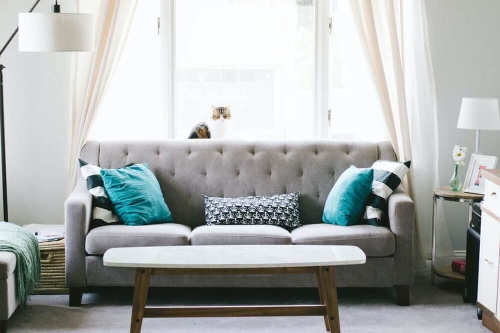 Grey sofa and long curtains