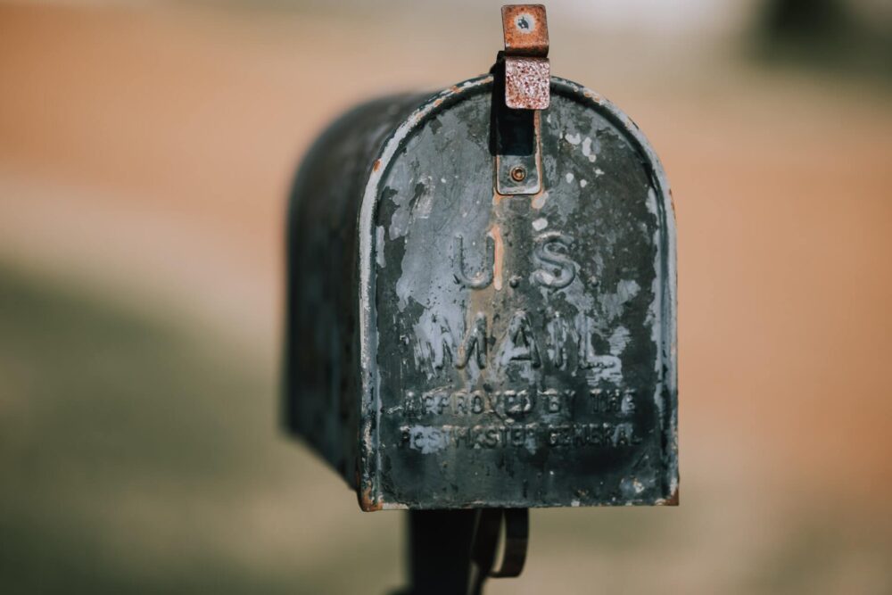 White mailbox in front of a house