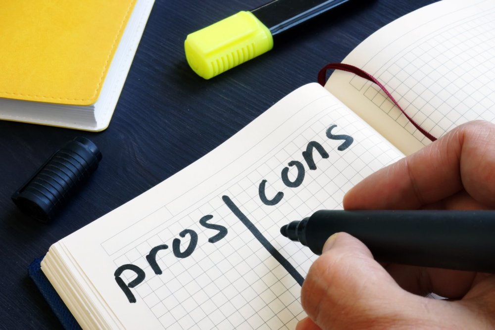 A person creating a pros and cons list