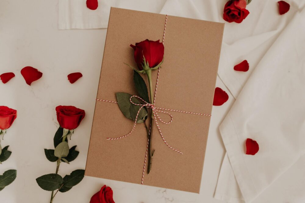 A red envelope filled with pretty red flowers