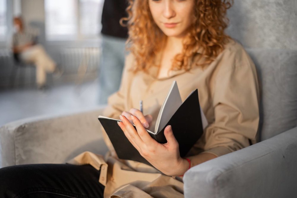 Woman writing in her diary 