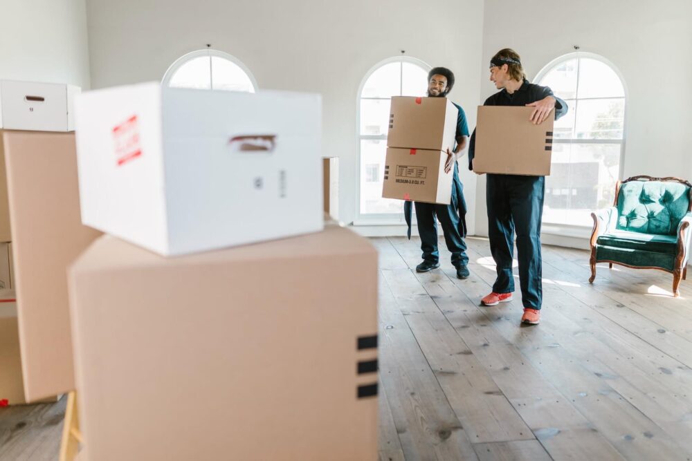 Long-distance movers carrying boxes