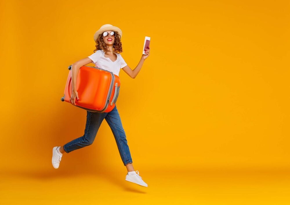 Woman carrying a blackboard and a box