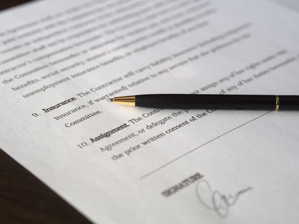 A contract and a pen