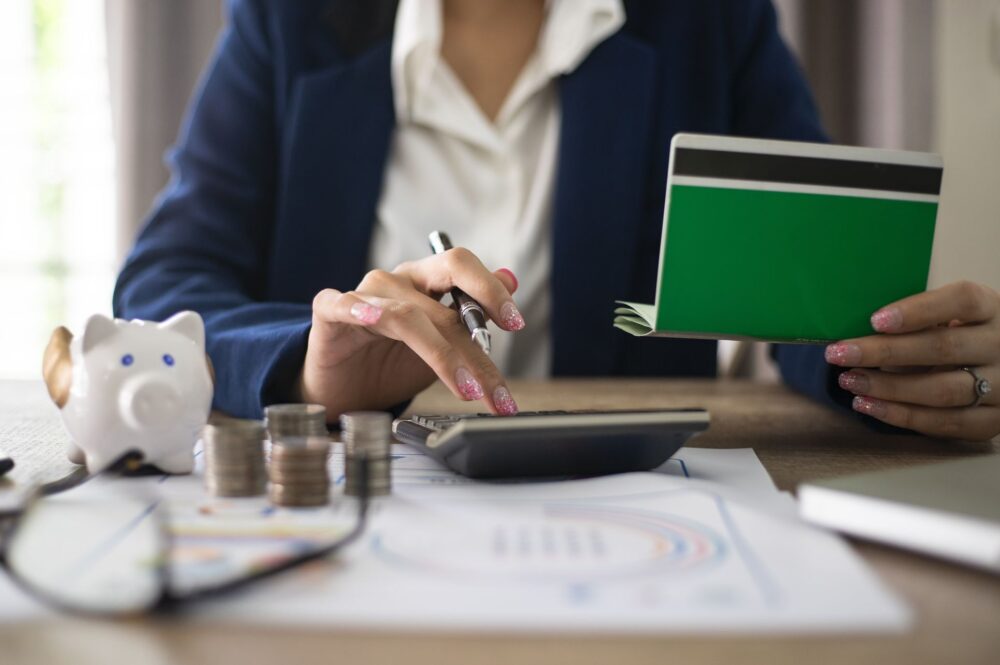 A woman calculating costs