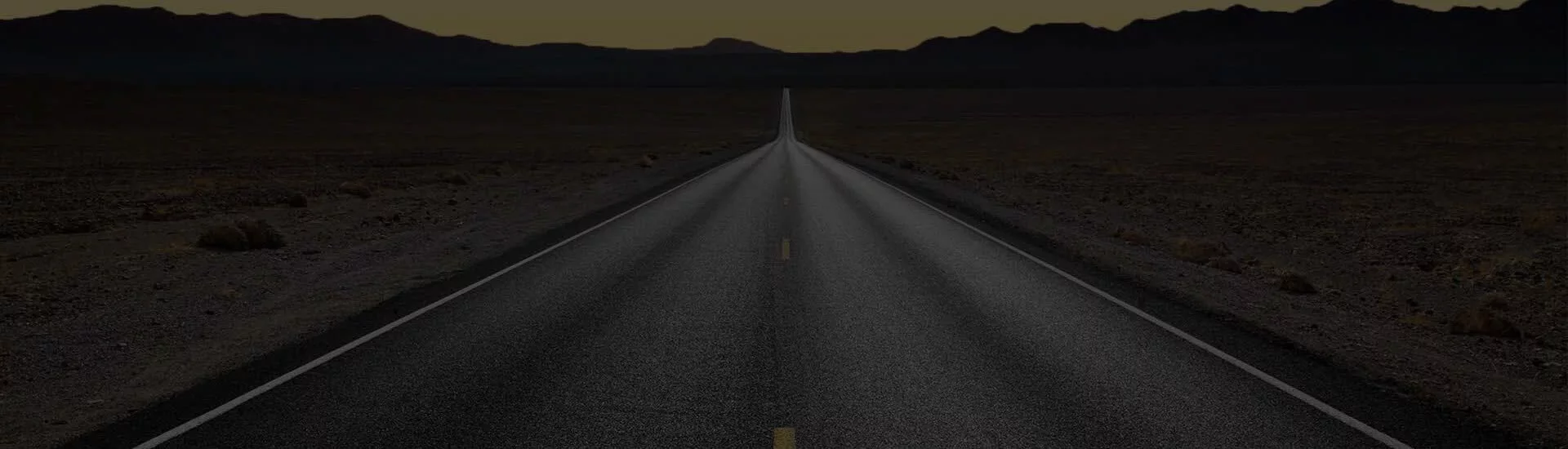 an empty road in the middle of nowhere