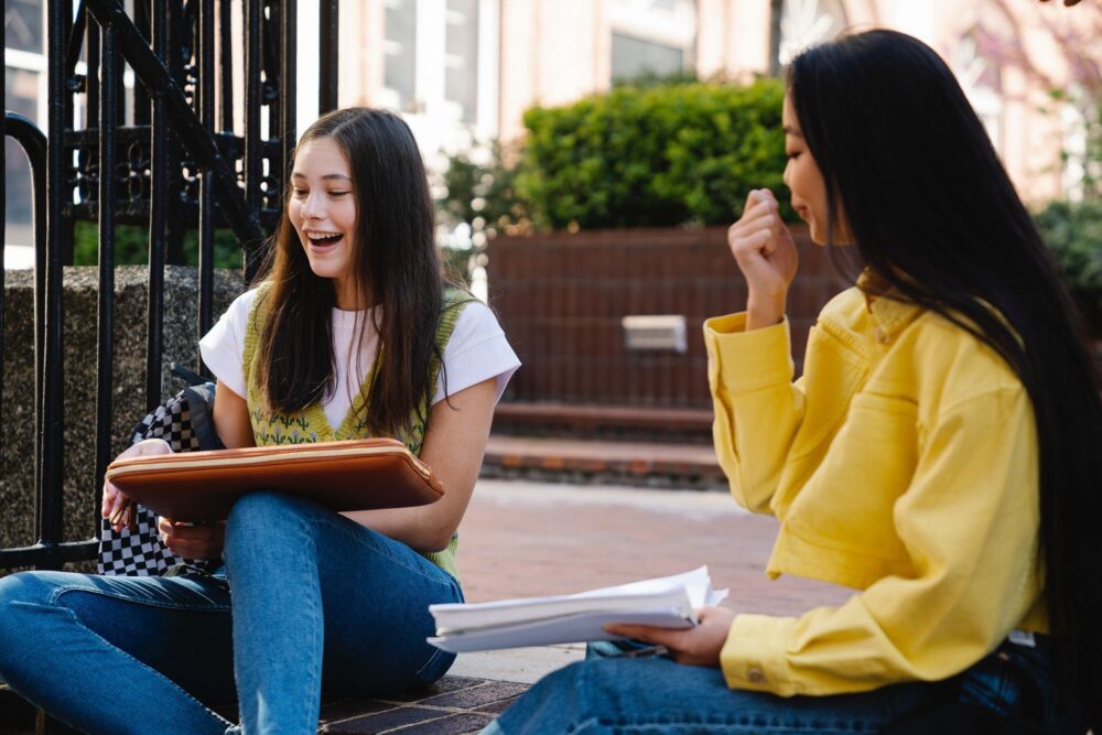 Two girls talking and smiling