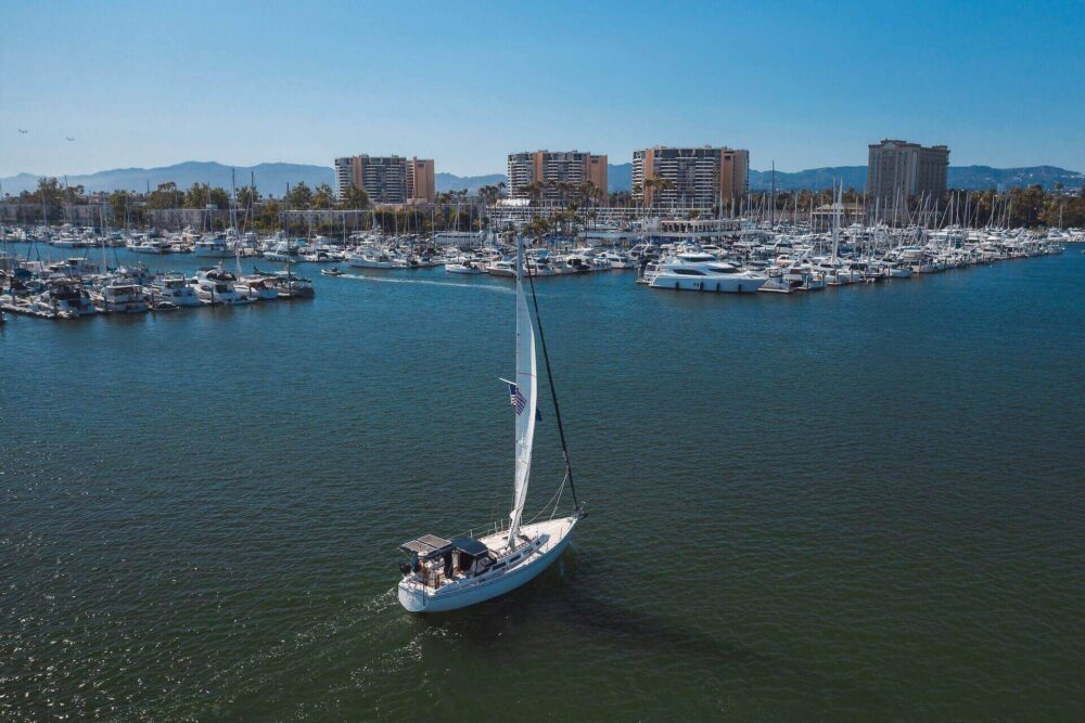 A white sailing boat in the ocean 