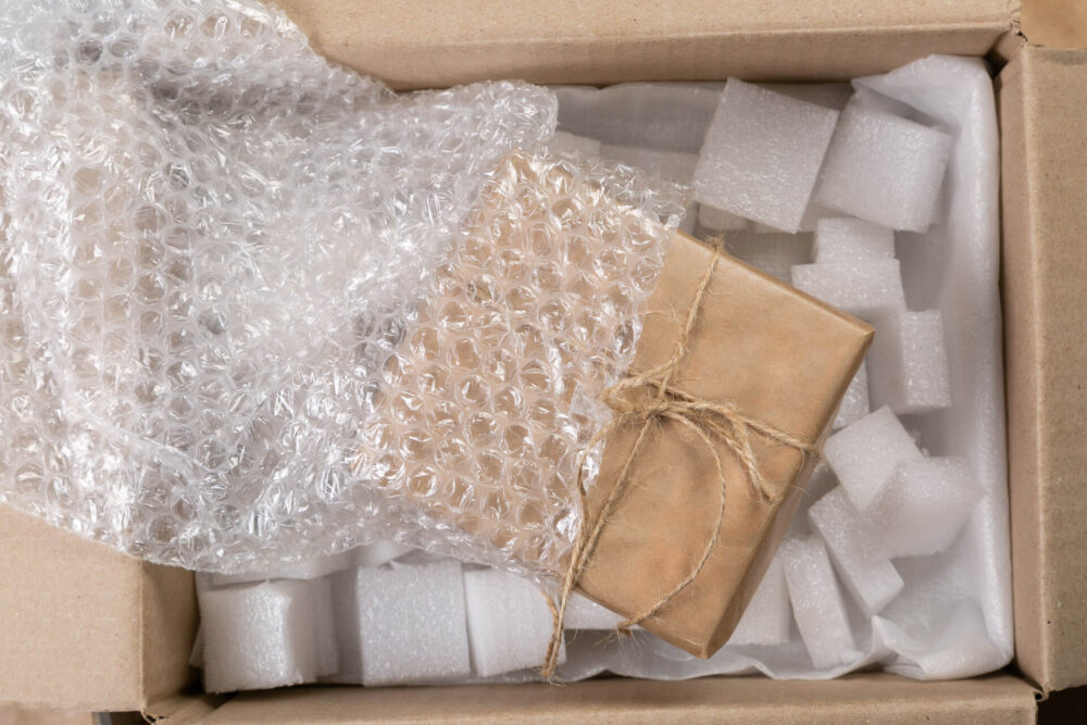 Inside of a box with a present and bubble wrap