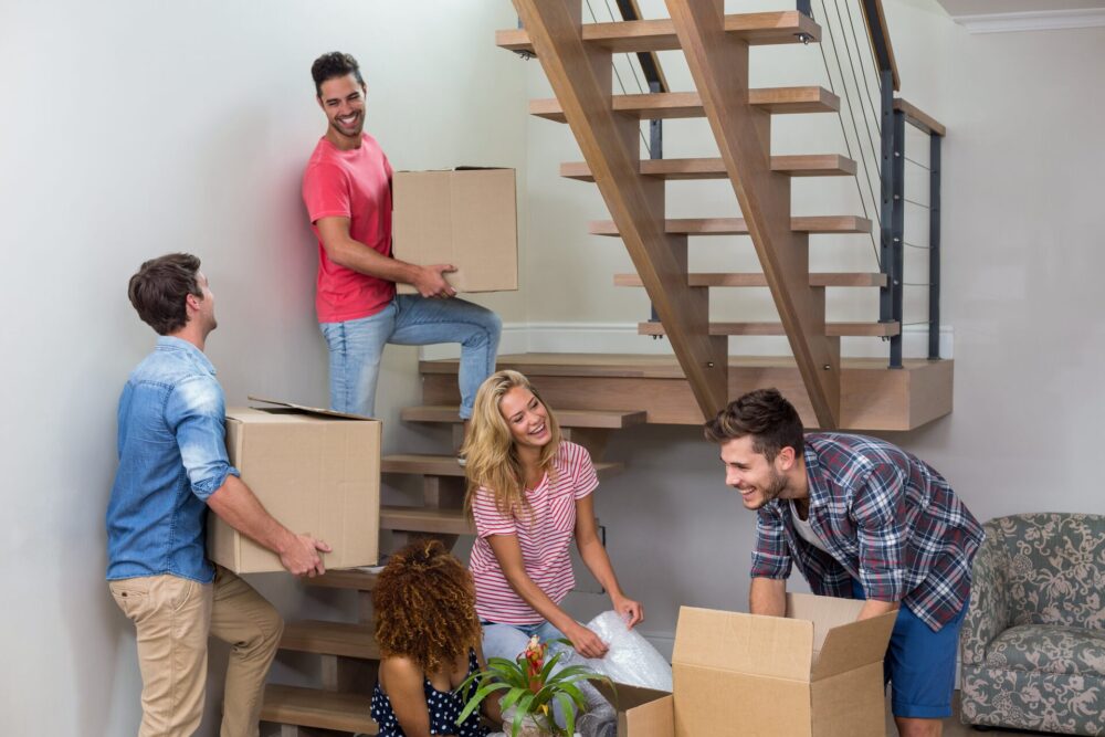 Roommates unpacking after long-distance moving