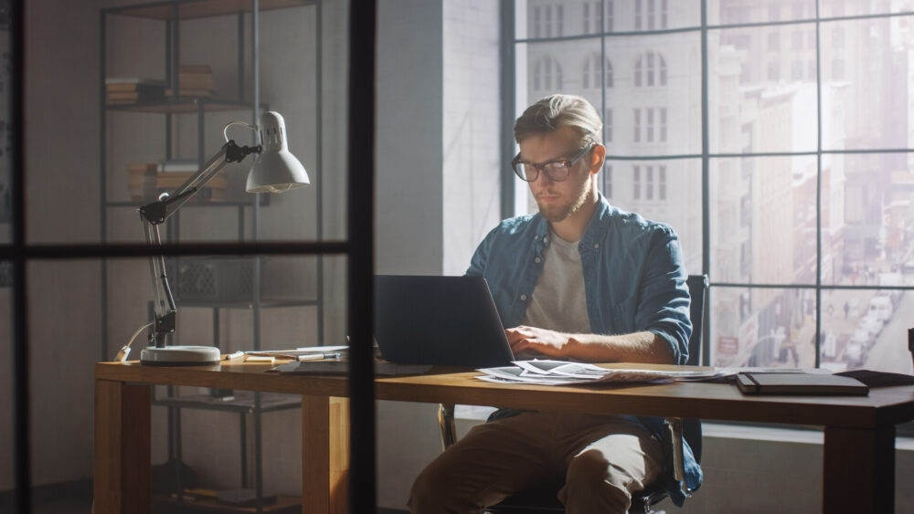 A man working on a laptop for home