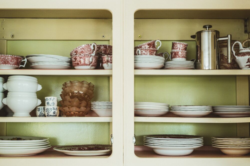 China, bowls, and plates stacked on a shelf