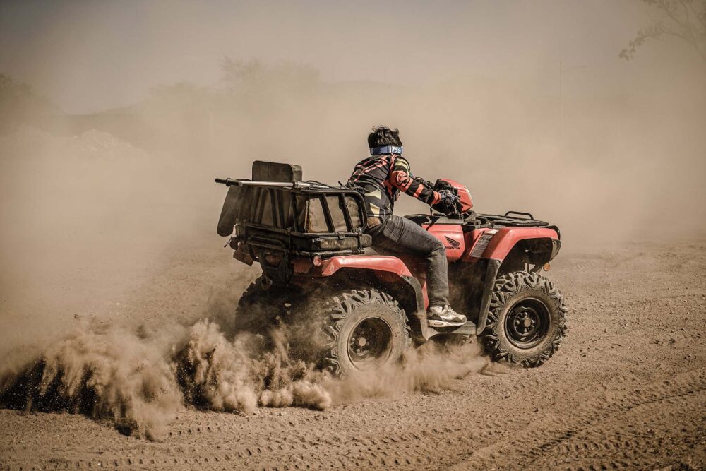 Man on a quad bike making dust 