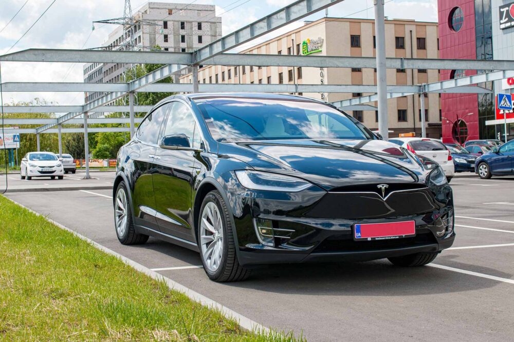 A parked black Tesla vehicle