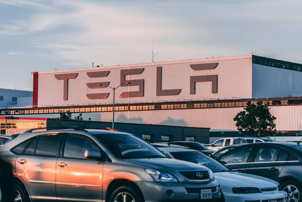 Cars parked in front of Tesla building