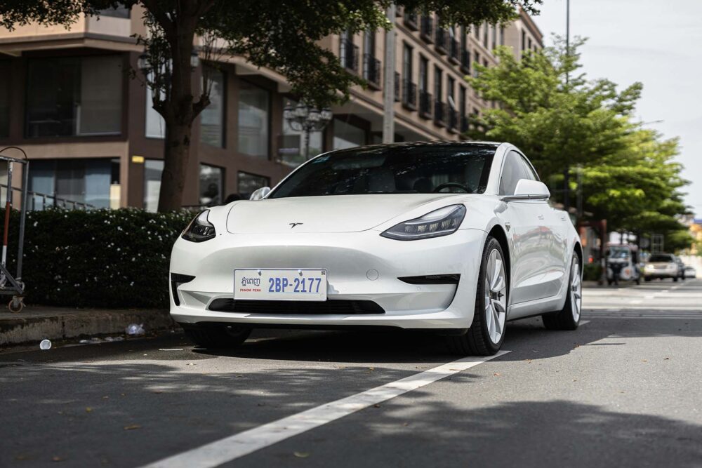 White Tesla parked on the road