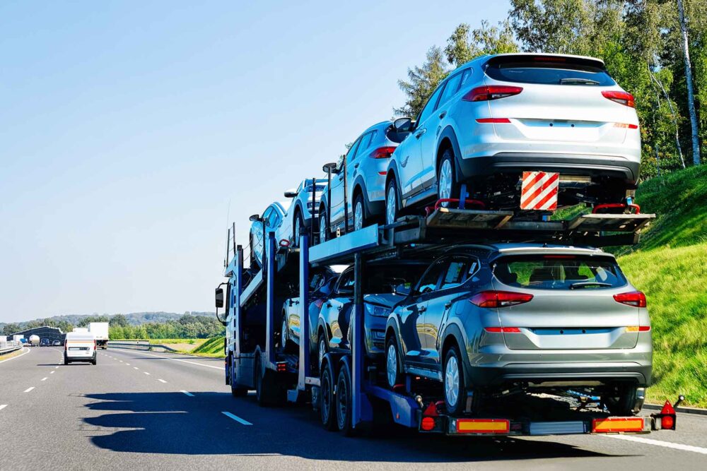  Car carrier truck on the asphalt road. Truck transporter