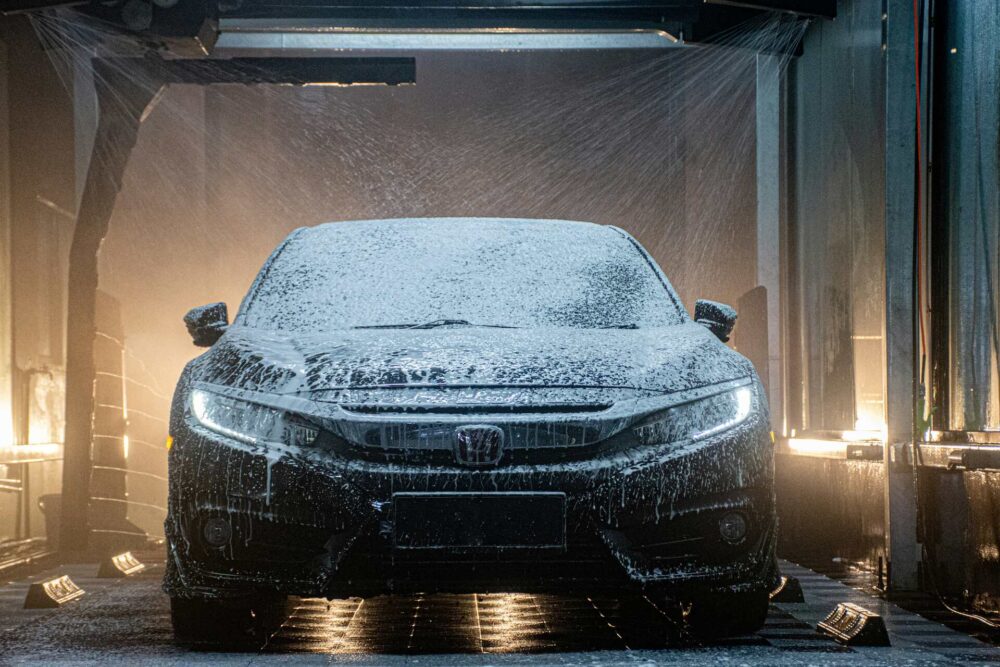 Black car being washed