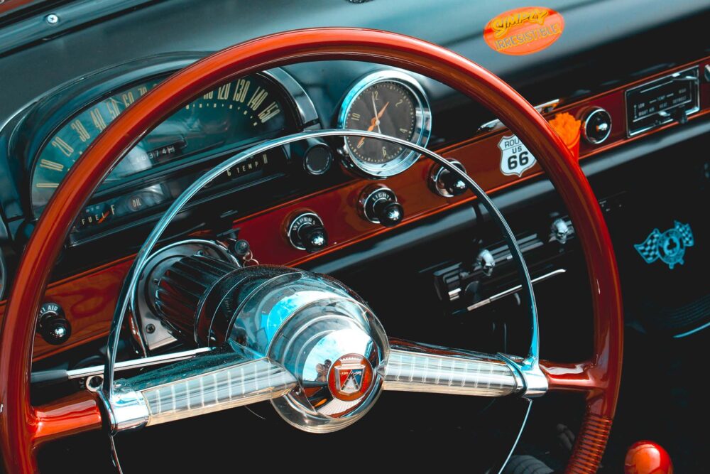 Red steering wheel of a vintage automobile